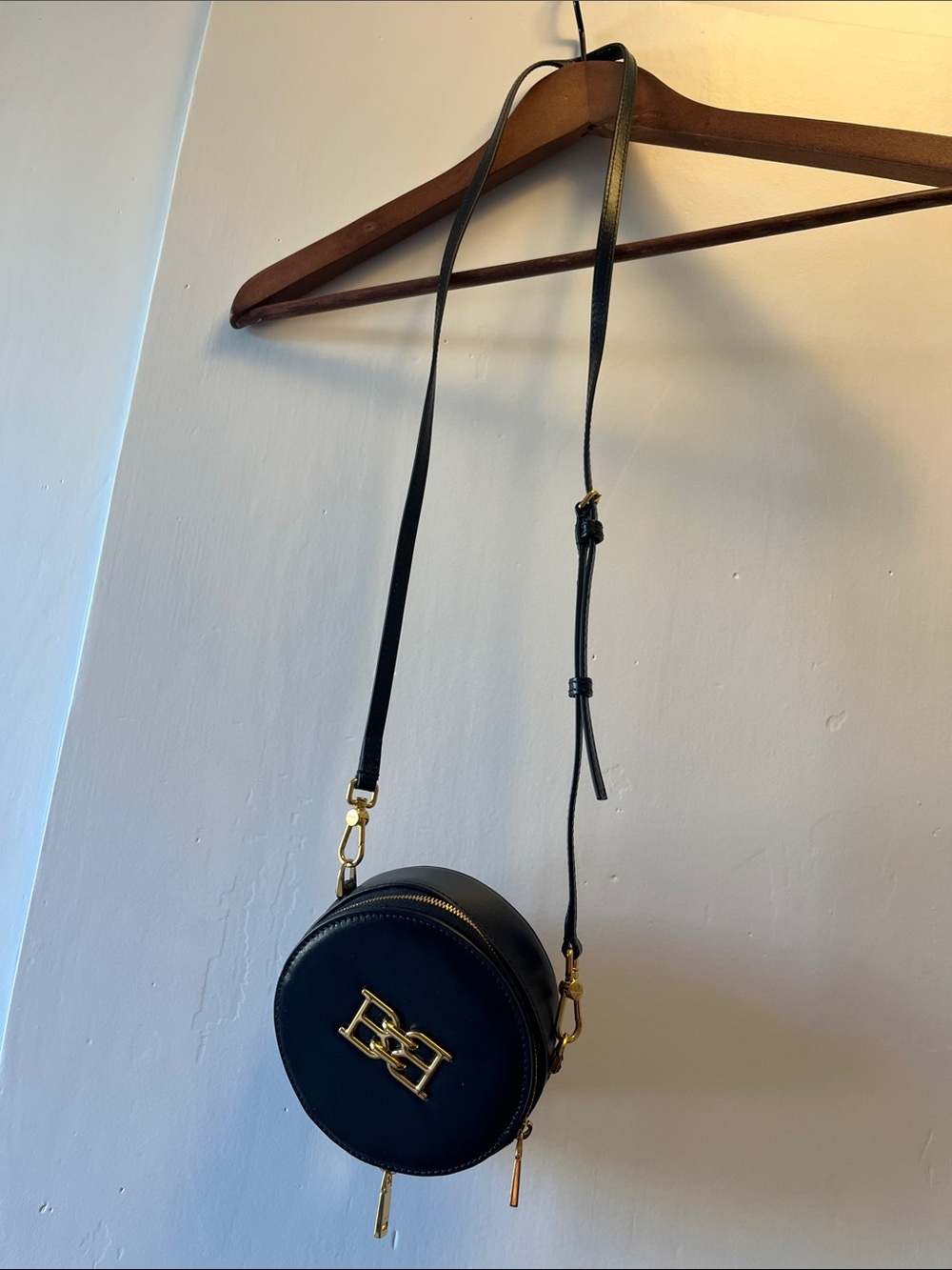 Cute and fashionable, one of a kind Bally Black Round Crossbody with Gold Emblem